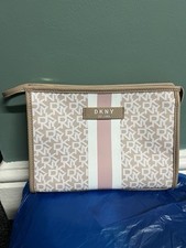 DKNY pouch or cosmetic bag. It features a beige and white color scheme