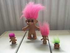 Retro collection of 4 troll dolls.