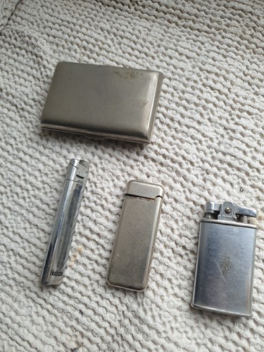 Old lighters and cigarette - and, tin