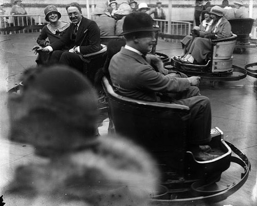 People riding the bumper cars