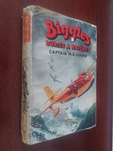 Biggles buries hatchet by - buries,