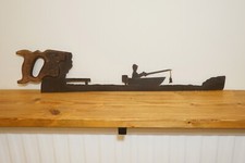 Man Fishing On A Boat Angler