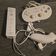 Nintendo Wii motion plus controller, control pad and nunchuck white.
