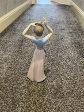 NAO By Lladro Girl Fixing Her