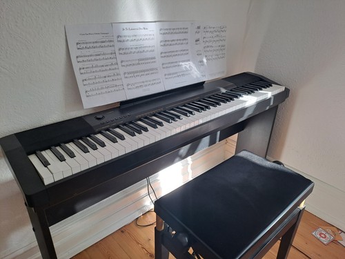 Casio digital piano with - , a