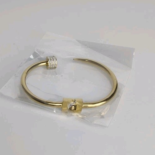 Gold tone metal bangle - gold,