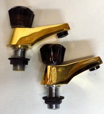 Gold/brass plated bath taps -
