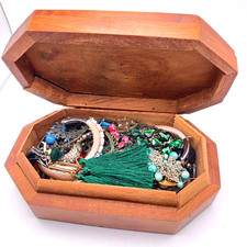 Wooden box full odd and broken earrings for crafting decorative handmade chest