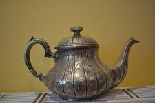 Antique Silver Plate/metal Samuel Evans highly decorative teapot.