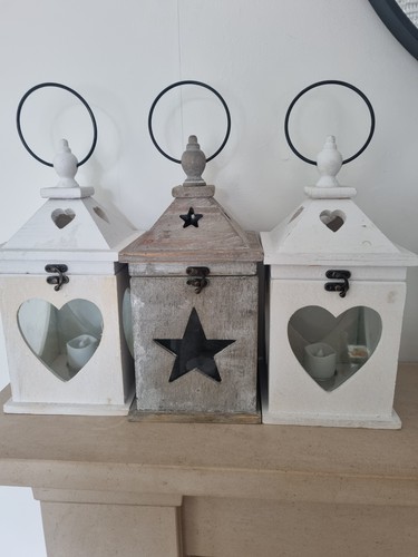 Three wooden lanterns for - three,