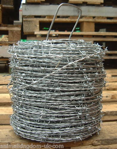 Barbed wire livestock field - -,
