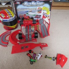 Micro Machines Formula 1 Grand Prix Folding Out Playset and helmet racetrack set