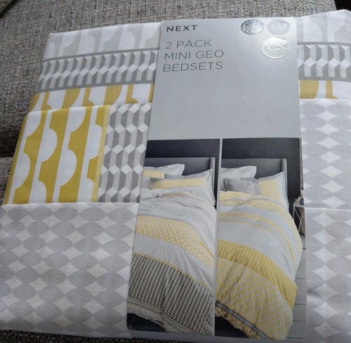 Next yellow grey and white - and,