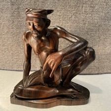 Carving Of Javanese Man In Sarong