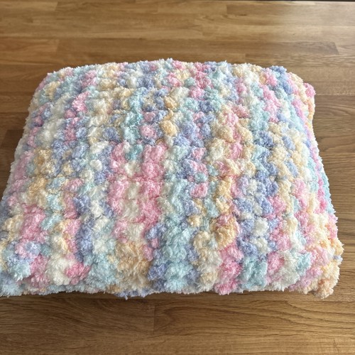 Hand knitted cushion with