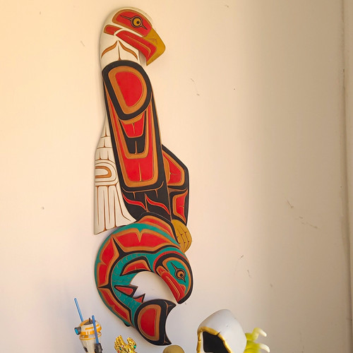 Hand carved wooden eagle with - hand,