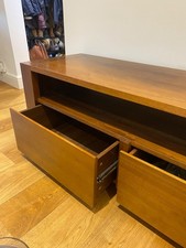 dark wood TV unit with drawers