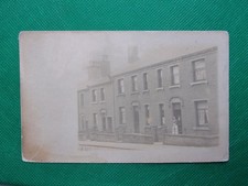 Postcard - Huddersfield? Real Photo showing terraced houses. Posted 1903. B10