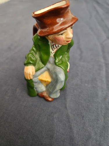 Small old man seated - old,