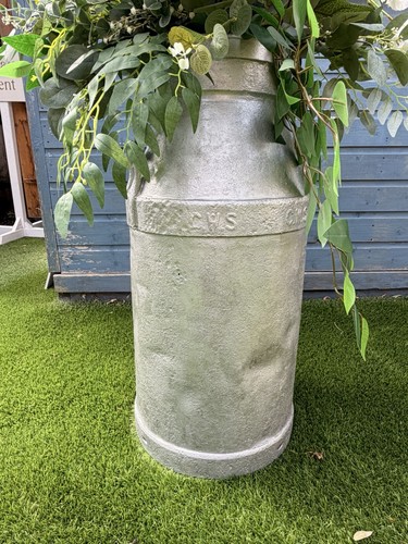 Milk churns with - churns, flowers