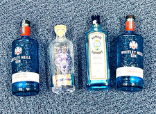 4 empty GIN bottles in BLUE