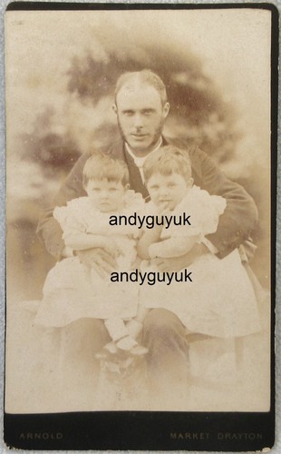 Cdv man holding two - holding,