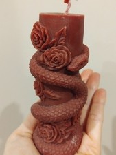 red altar snake roses candle