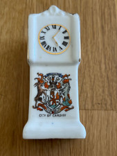 crested grandfather clock -