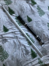 Custom lightsaber with extended handle and extra long blade