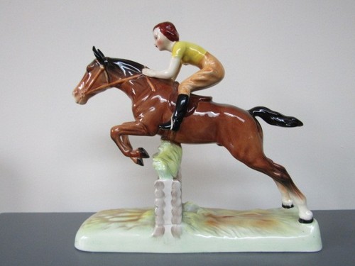 Beswick girl jumping horse - on,