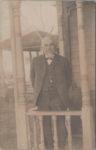 Elderly man standing porch - standing,