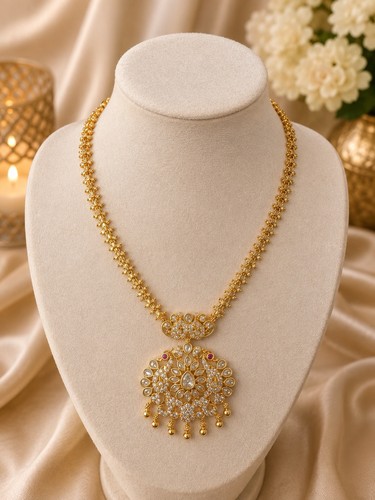 Gold tone kundan peacock long - tone,