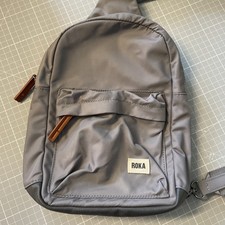 ROKA  Willesden Scooter sling bag in grey. 