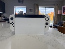 Nintendo Switch OLED White 64GB with 128GB MicroSD and Screen Protector