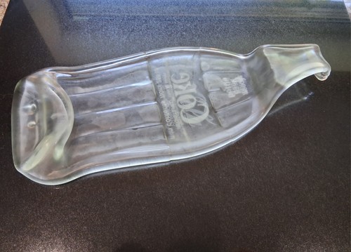 Melted glass coke bottle - melted,