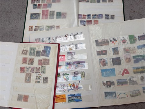 Partially filled stamp album - partially,