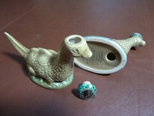 Two Beswick Loch Ness Monster Whisky Flasks, head and base openings, empty.