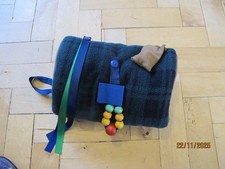 Tartan fleece muff with fiddle
