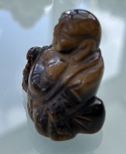 Vintage hand carved tigers - hand, eye
