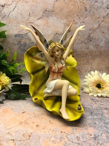 Fairy resting leaf figurine - fairy, on