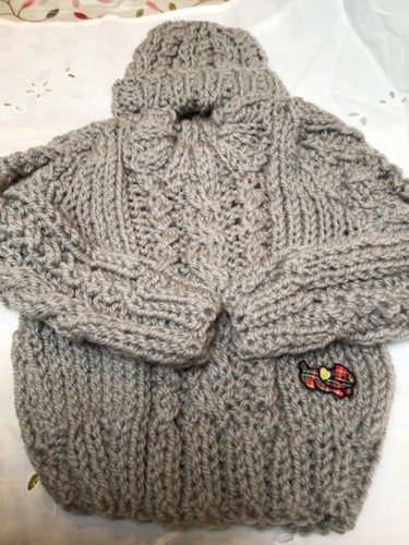 Hand knitted childs cable - hand,