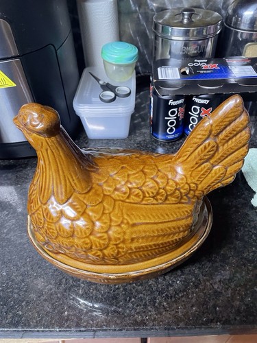 Moira hand crafted chicken egg - hand,