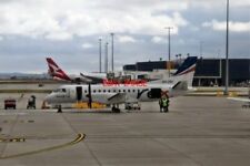 PHOTO  REX SAAB 340B VH-ZRC AT MELBOURNE AIRPORT