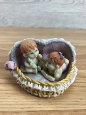 Babies In Heart Shaped Basket