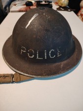 2 police helmets and 1 British