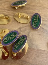 11 UNISON LAPEL BADGE Trade