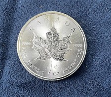2014 Canadian 1 oz. Silver Maple Leaf  $5 dollar coin with maple leaf privy mark