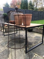 Solid garden obelisk in iron, topped with finial and rust finish. 