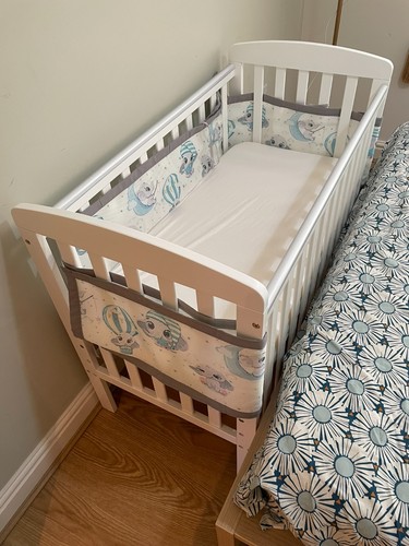Wheeled baby cot with mattress