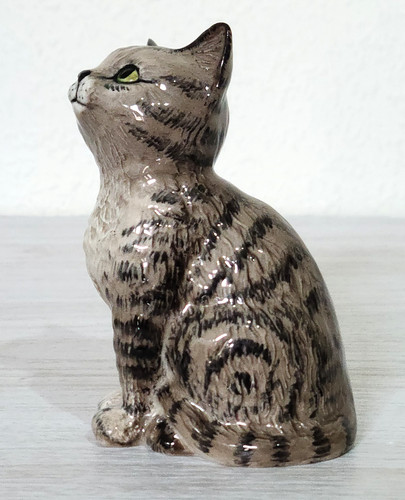 Beswick seated looking grey - looking, up